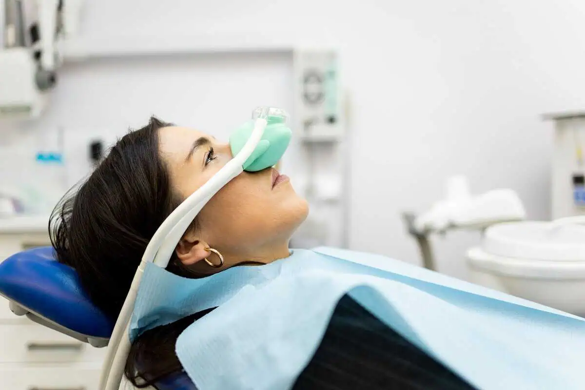 Patient receiving ProNox™ nitrous oxide and oxygen sedation in a medical office